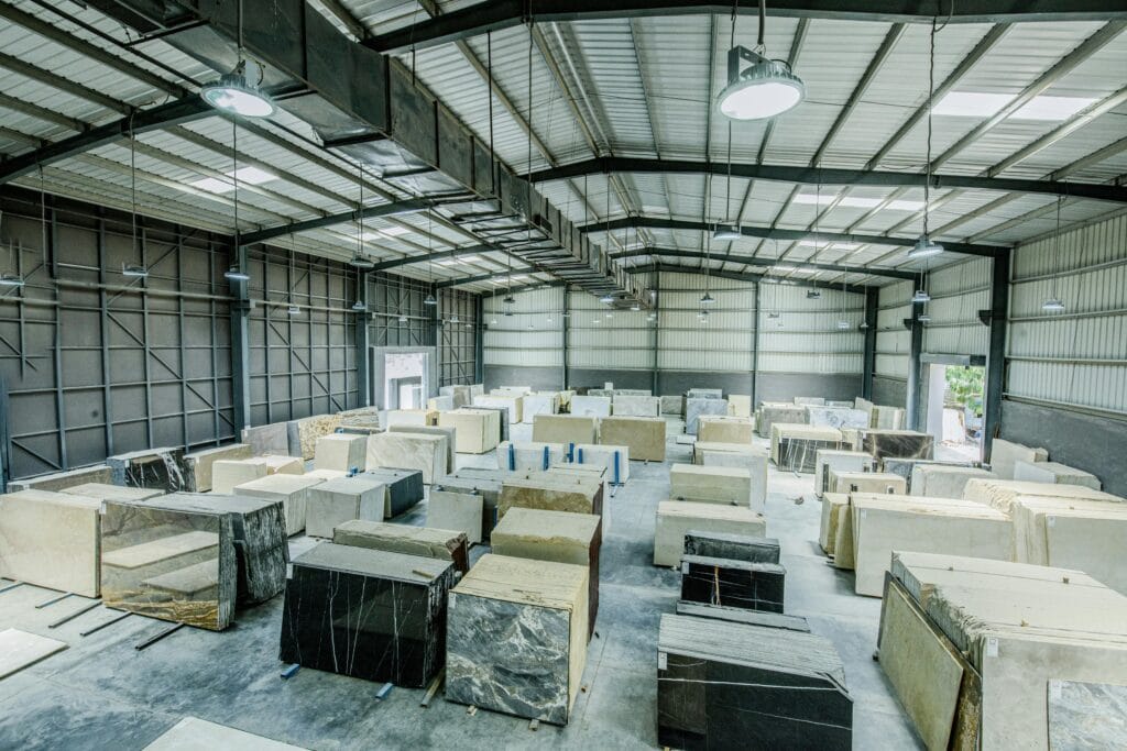 Expansive warehouse filled with large stone slabs